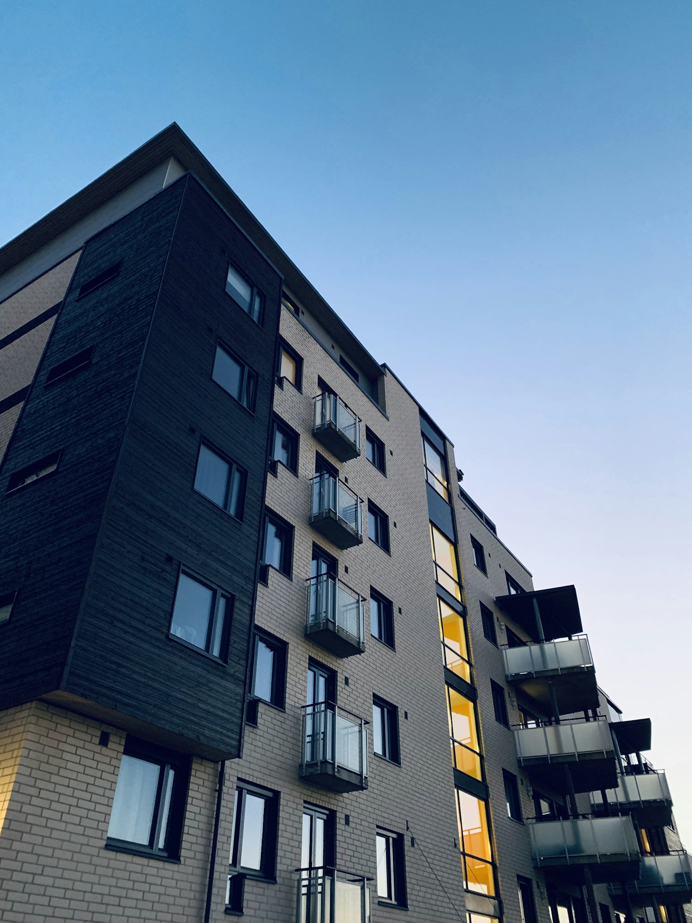 Contemporary multifamily building with stacked balconies